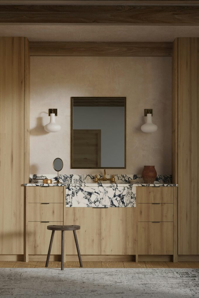 Contemporary bathroom with wooden cabinets and a marble countertop, featuring stylish lighting fixtures.